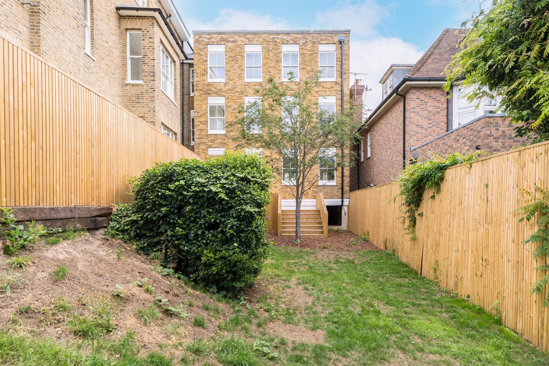 Completed rear garden and terrace · July 2026
