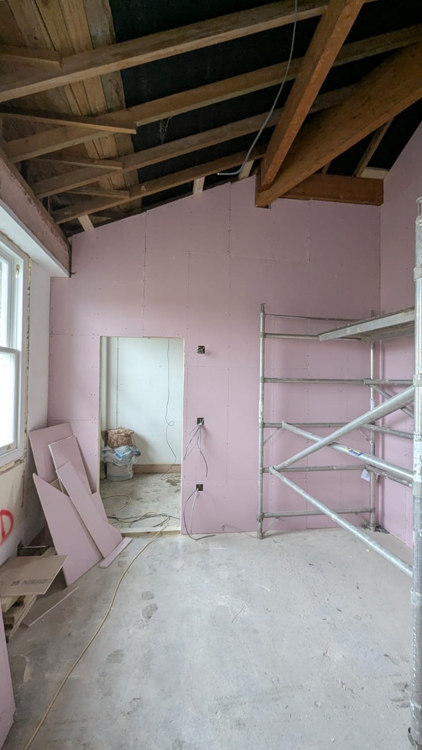 Upper room · Exposed roof truss and new linings · October 2025