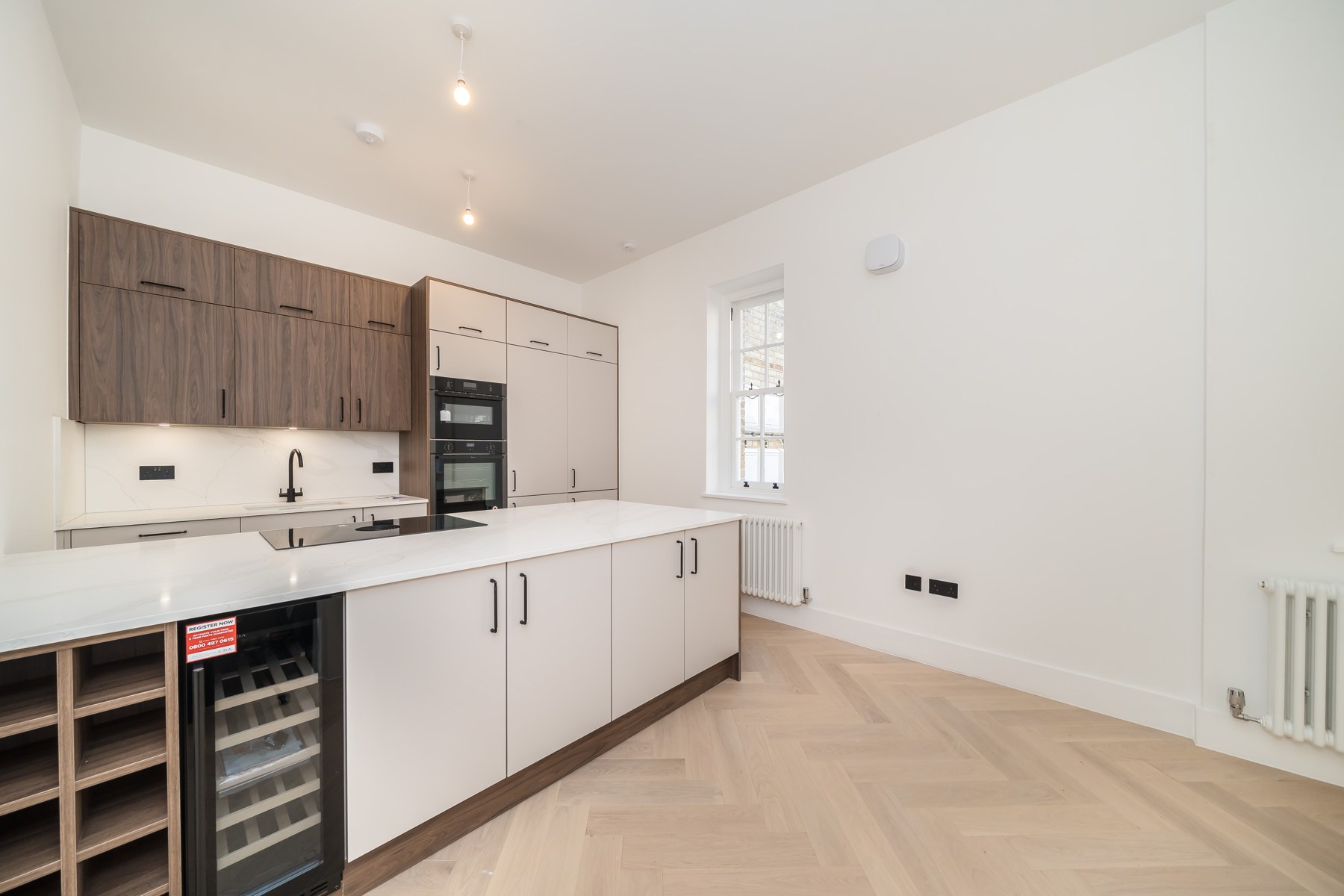 Finished apartment kitchen · July 2026